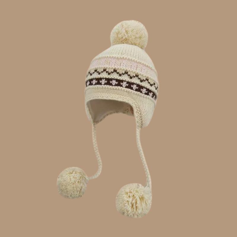 Autumn and winter lace-up ear protectors knitted hat women's Fair Island wind bag head hairball hat thickened warm jacquard wool hat