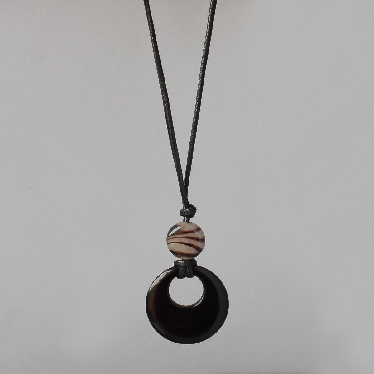 

Круглая подвеска из лазурита на черном шнурке