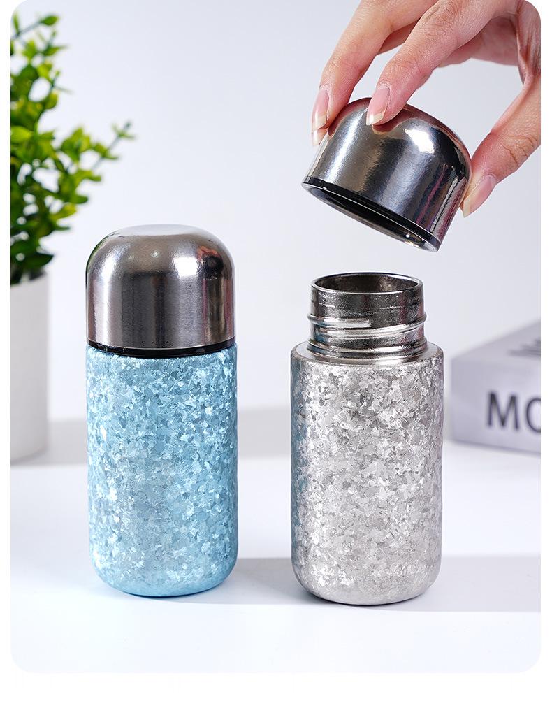 > Sleek Mini Titanium Antibacterial Double-Layer Thermos Cup - Portable, High-Value, Pocket-Sized.