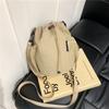 Niche design sense drawstring bucket bag outdoor sports leisure fashion versatile bag messenger bag women