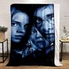 Dark, blue-toned portrait with sharp contrast and partial face visibility. for all seasons blanket lunch break throw gift