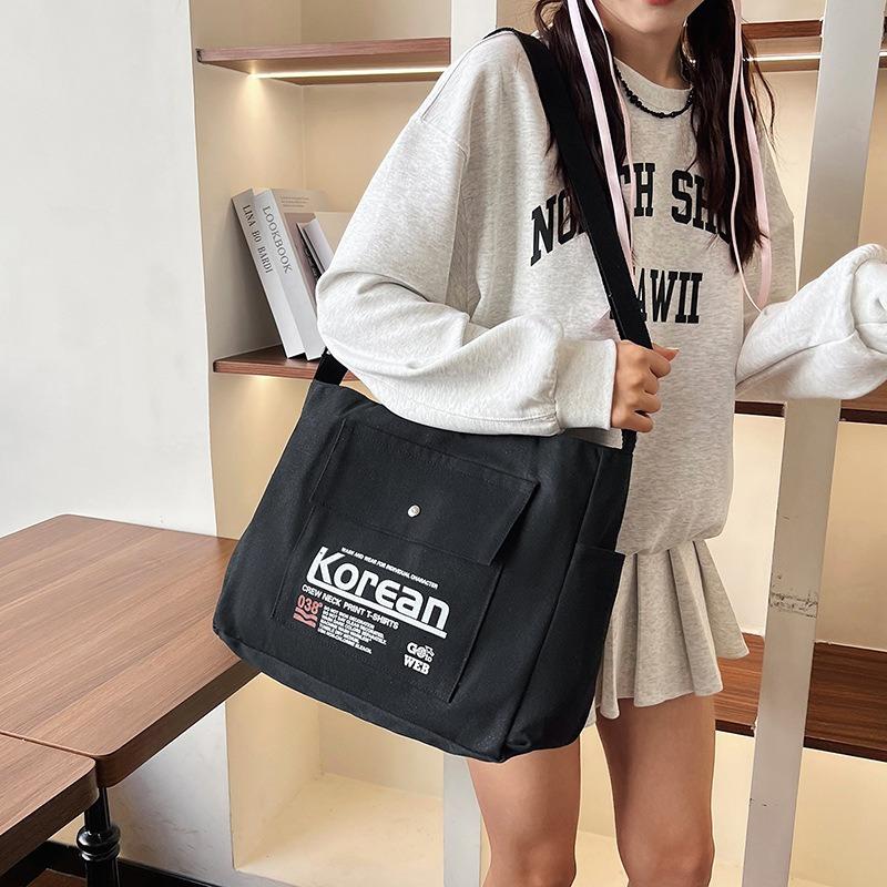Simple style women's hand-held canvas bag New trendy versatile messenger shoulder bag Large capacity student commuter armpit bag