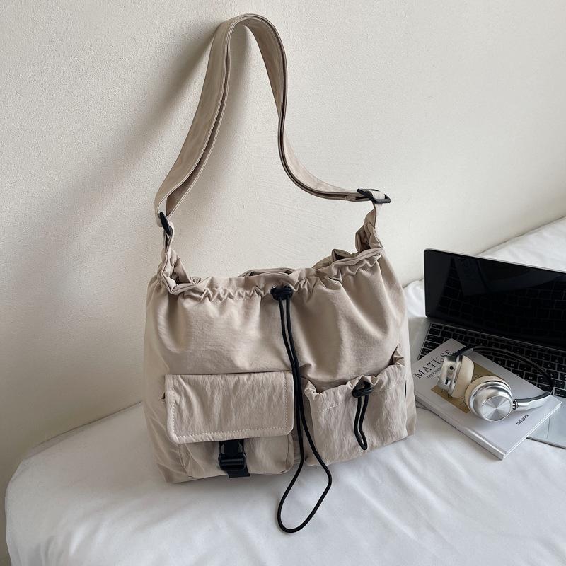 Large capacity waterproof nylon cloth drawstring shoulder bag 2025 new travel leisure fashion tote bag