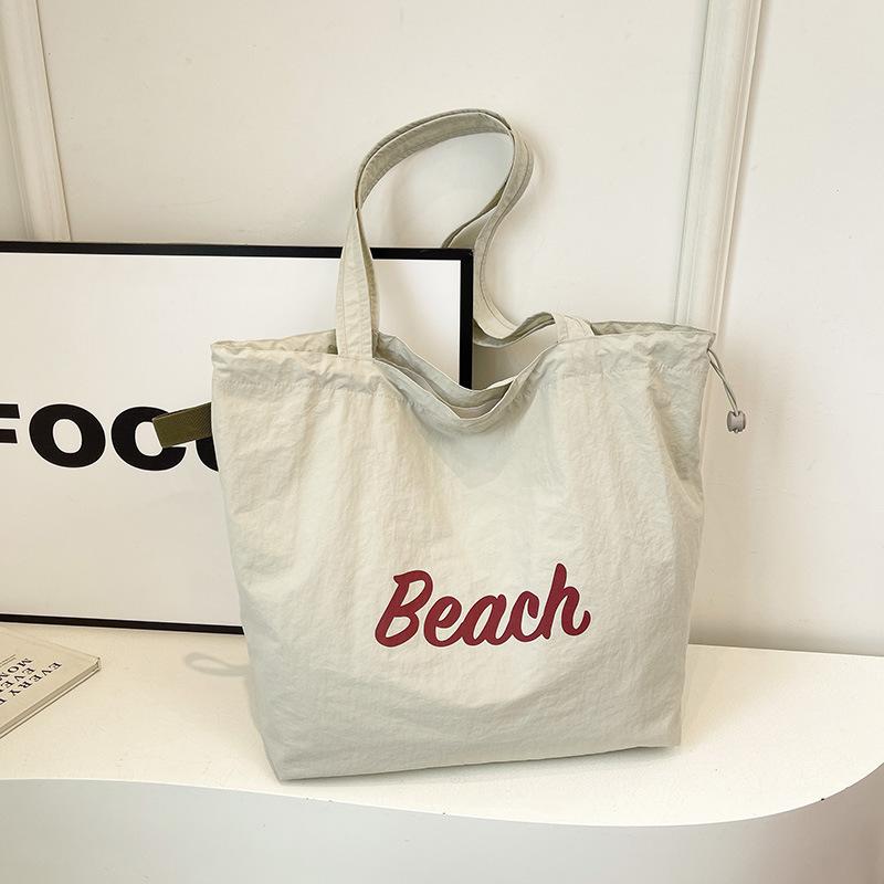 Korean version of the new letter printing bag women's large-capacity nylon shoulder bag casual versatile portable drawstring tote bag