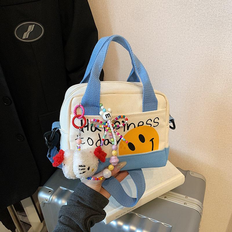 Cute Smiley Girl Handbag Hand Carry Out High Value Canvas Bag Korean Version Printed Trend Shoulder Messenger Bag