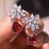Huitan Oumei Red Pear-Cut Cubic Zirconia Drop Earrings with Diamond-Studded Accents