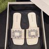 Wearing square head one-word drag rhinestone square buckle middle heel sandals women's summer new thick heel fashion slippers tide