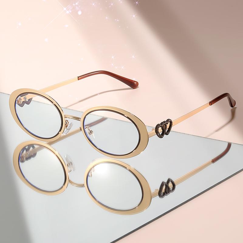 

Новые очки овальной формы с защитой от синего света имеют маленькую металлическую оправу с украшением в форме сердца для повседневной носки золотистый