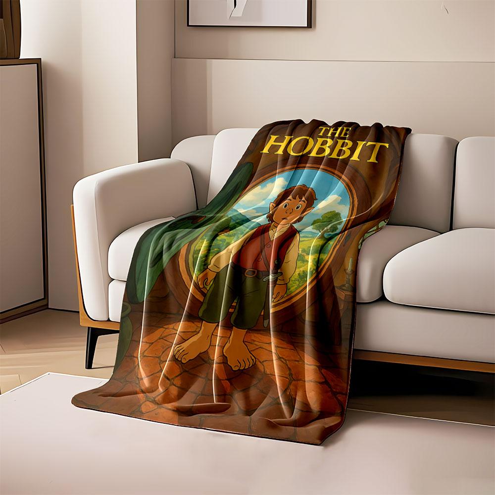 

A hobbit stands in a round doorway with a scenic landscape beyond. for all seasons blanket lunch break throw gift 80cm x 120cm