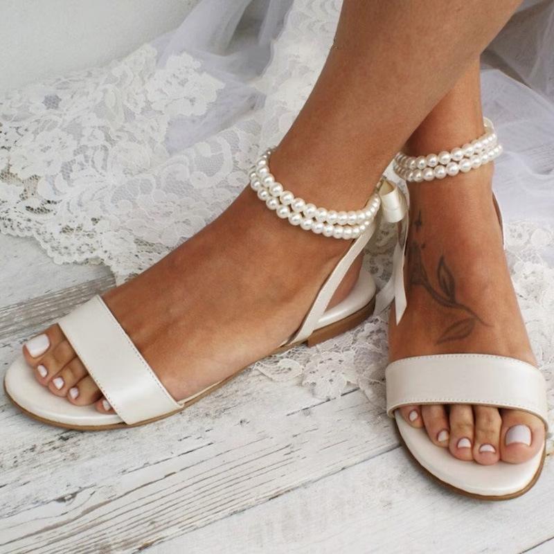 European and American New Spring and Summer Women's Flat Sandals Pearl Ribbon Sexy Foreign Trade White Women's Shoes Classic Wedding Shoes
