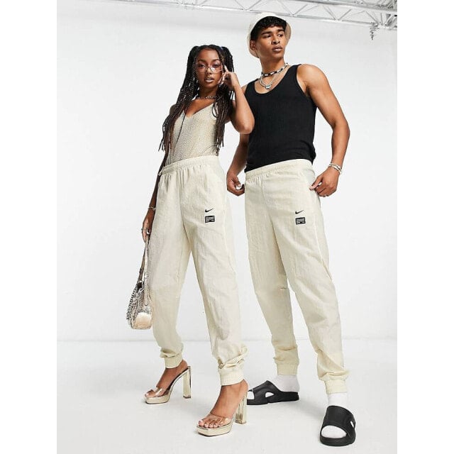 

Тканые джоггеры унисекс из камня Nike Football FC