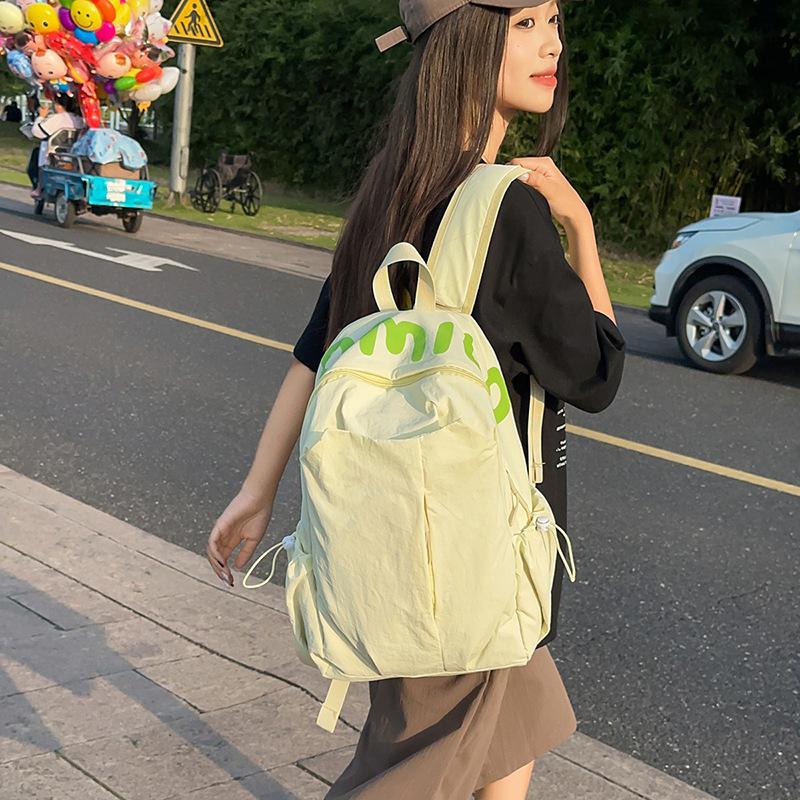 Solid color simple outdoor style backpack women's design sense niche light schoolbag high-value large-capacity backpack women