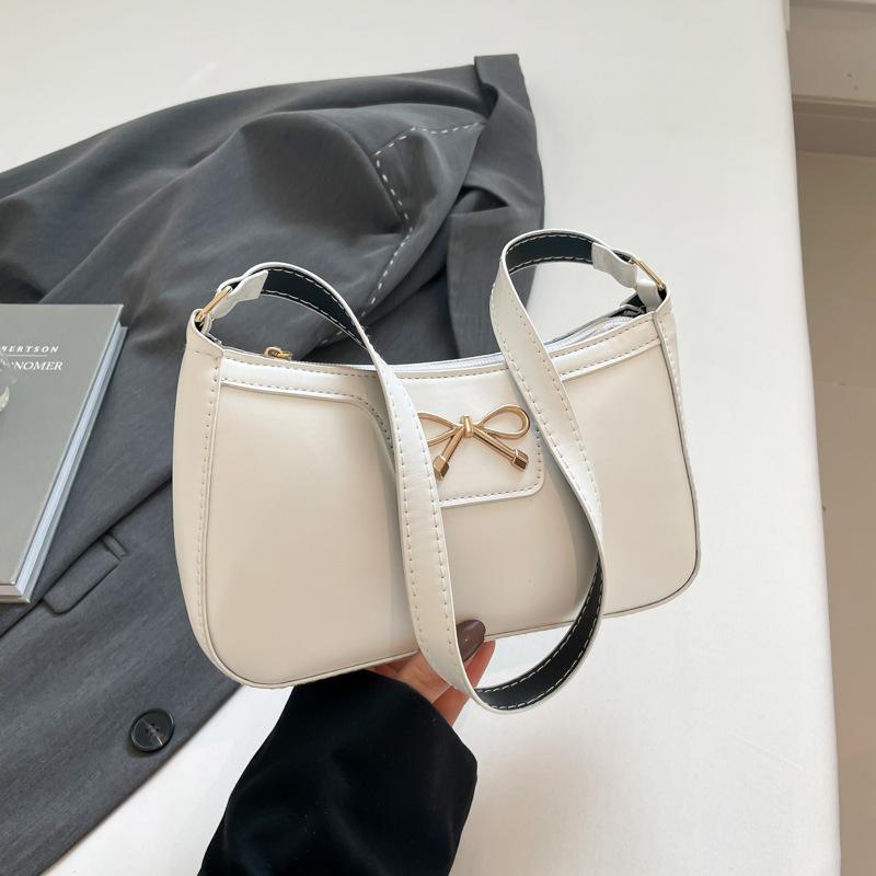 Fashion bow 2025 solid color new Korean version trendy texture foreign style commuting single shoulder underarm baguette bag women