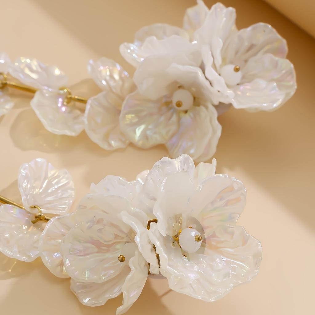A pair of women's long earrings in bohemian style, made of acrylic with iridescent shells, flowers, and crystals, suitable as a holiday gift