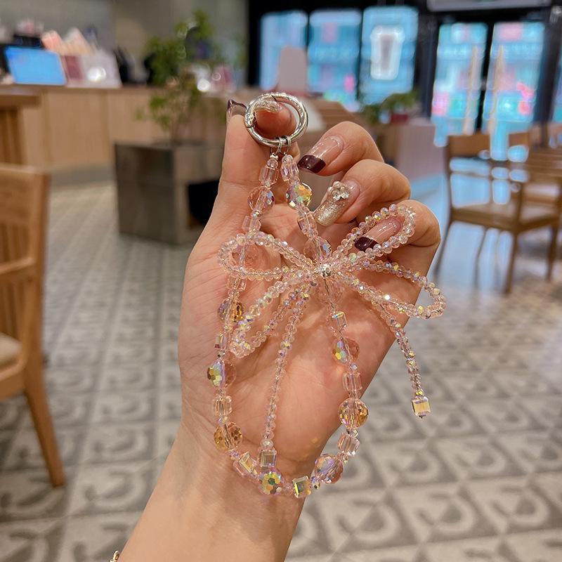 

Изысканный брелок с ромбовидным хрустальным бантом и стразами - Стильный шарм для ключей от машины и сумки розовый