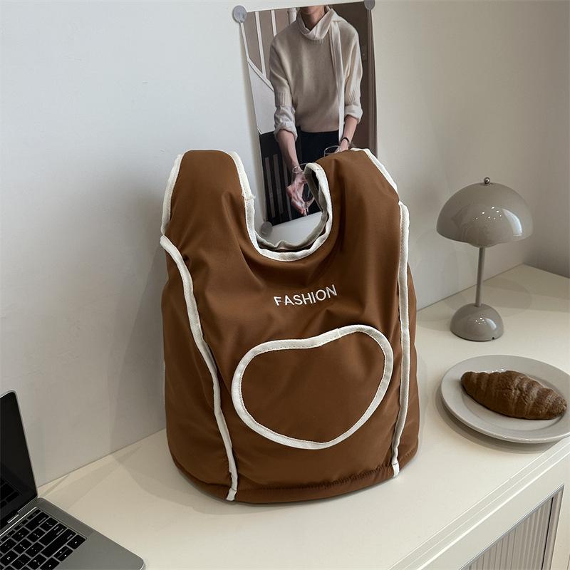 

Korean version of casual large-capacity bag women s 2025 new simple nylon backpack, student class commuter backpack коричневый