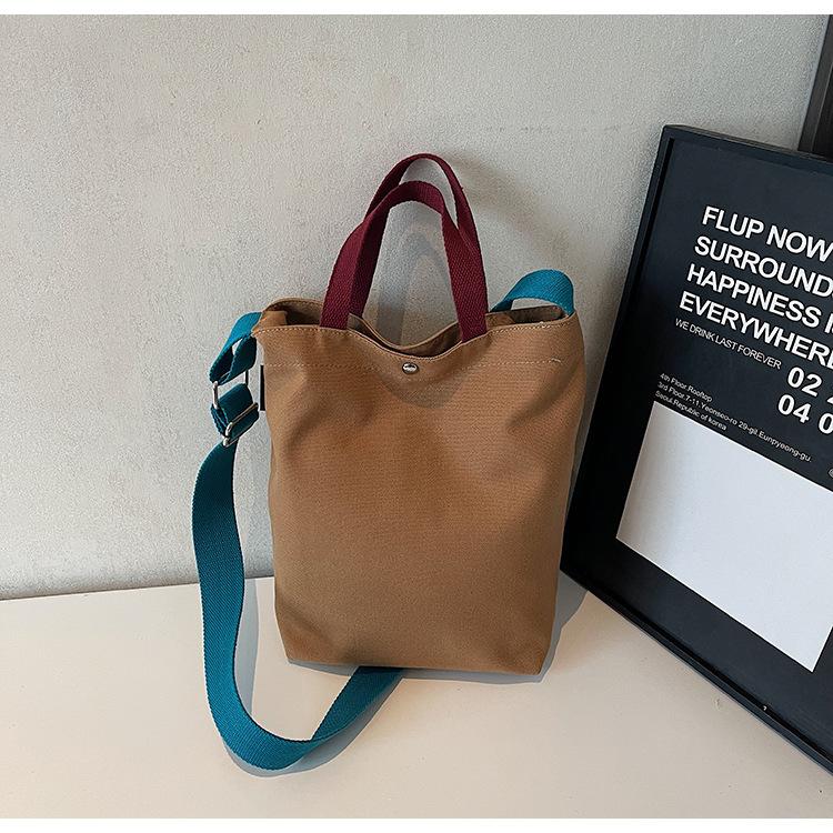 

Canvas water cup cover tote bag 2025 summer new large-capacity bag women s Japanese simple work commuter messenger bag