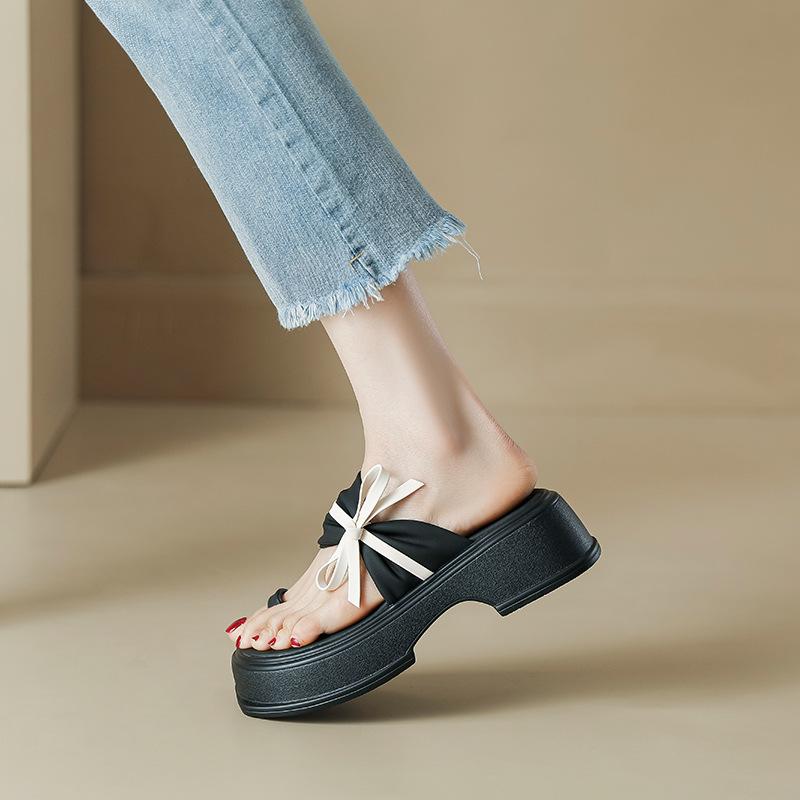 Retro thick-bottomed cool slippers wear summer new fashion bow one-word drag fairy wind cover toe Roman slippers girl