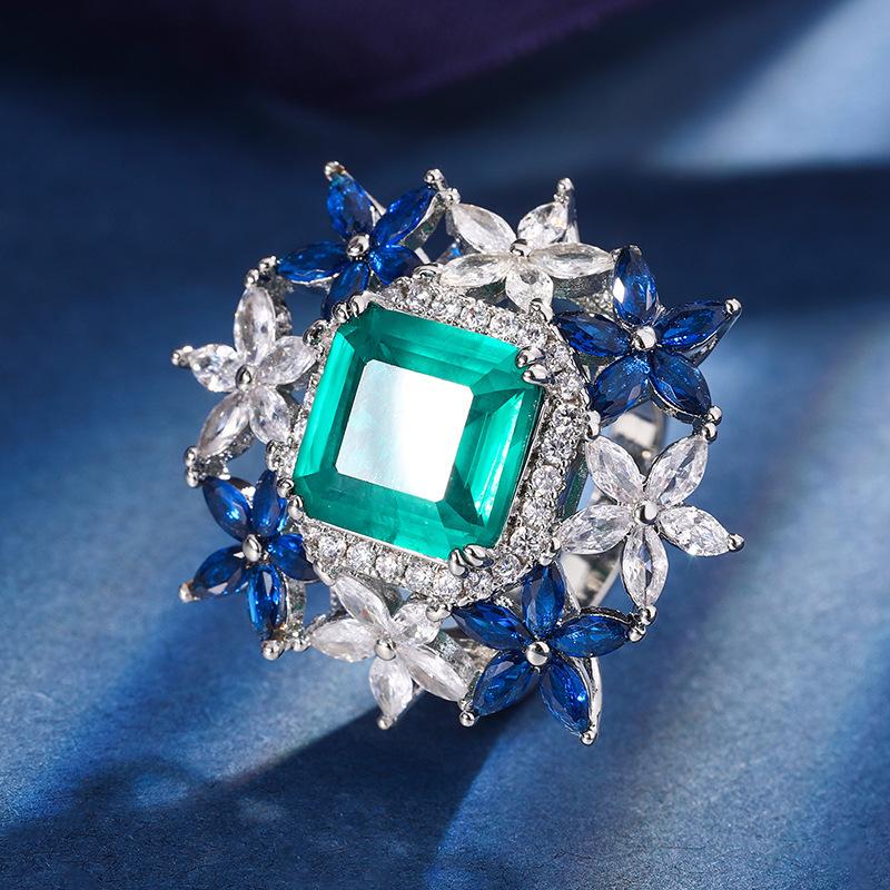 

Ювелирные изделия Медное основание Позолоченный ювелирный набор Имитация Красного корунда Изумрудный Цветочный набор Женский 10 * 10