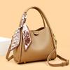 This Bucket Bag Is A Simple and Fashionable Urban Design with A Lychee Pattern and A Silk Scarf. It Is A Hand-held Shoulder Bag