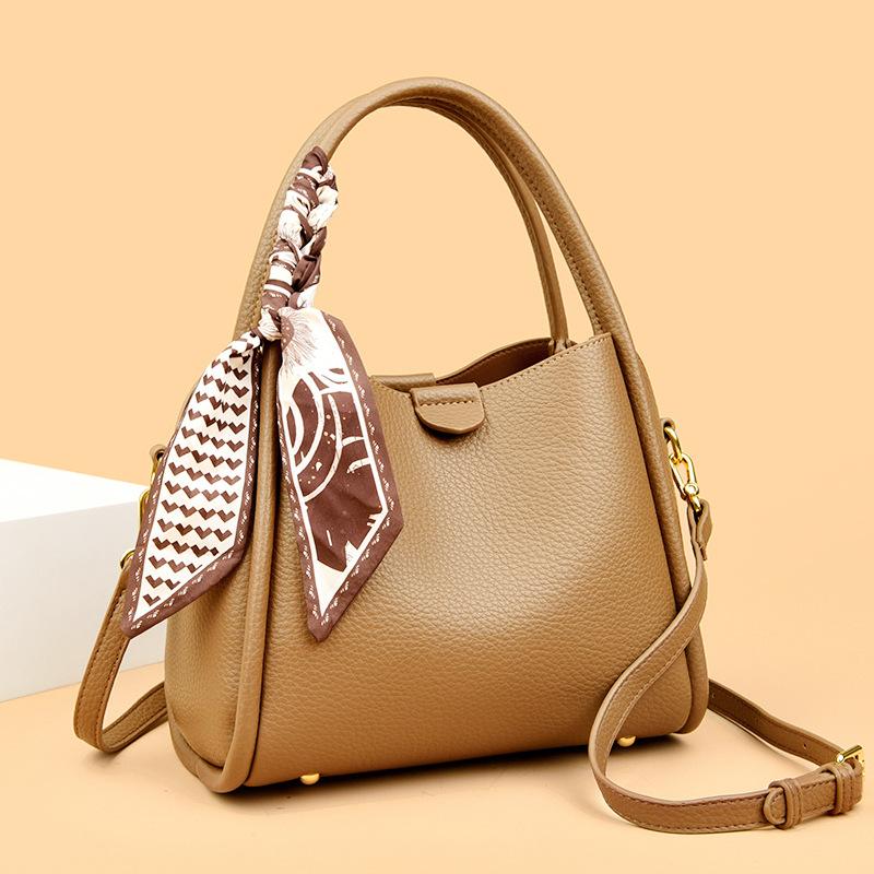 This Bucket Bag Is A Simple and Fashionable Urban Design with A Lychee Pattern and A Silk Scarf. It Is A Hand-held Shoulder Bag