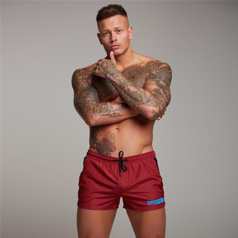 

Muscleguys Summer Bodybuilding Beach Jogging Short Pants Mens Basketball Training Shorts Gym Fitness Sport Breathable Quick Dry Shorts XXL червоний