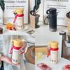 Isolierter Reisebecher mit Tragegurt und Strohhalm für Büro und Außenbereich