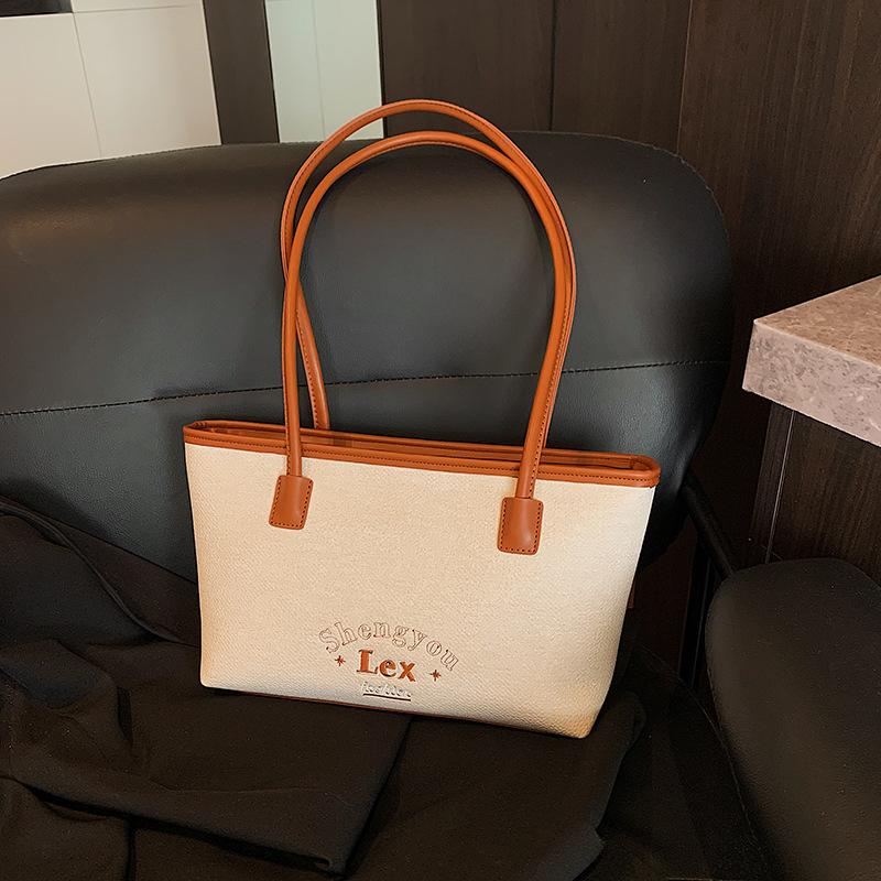 

Large capacity tote bag versatile fashion commuter bag women s summer new contrasting color shoulder armpit bag