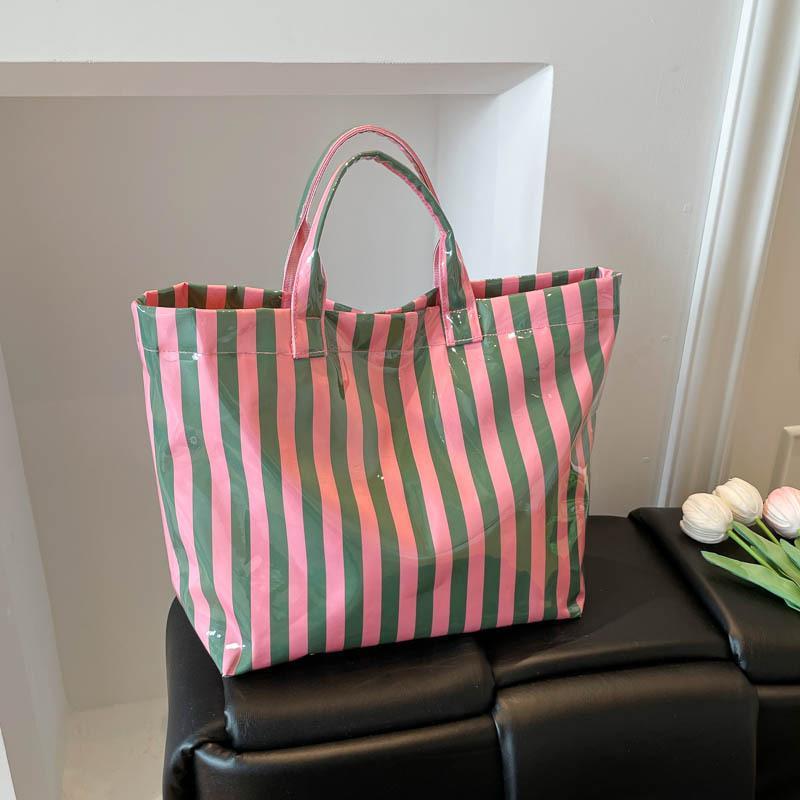 This Water-Resistant Pvc Tote Bag Features A Pink And Blue Striped Design, A Large Capacity, And Is Suitable For Beach Shopping,