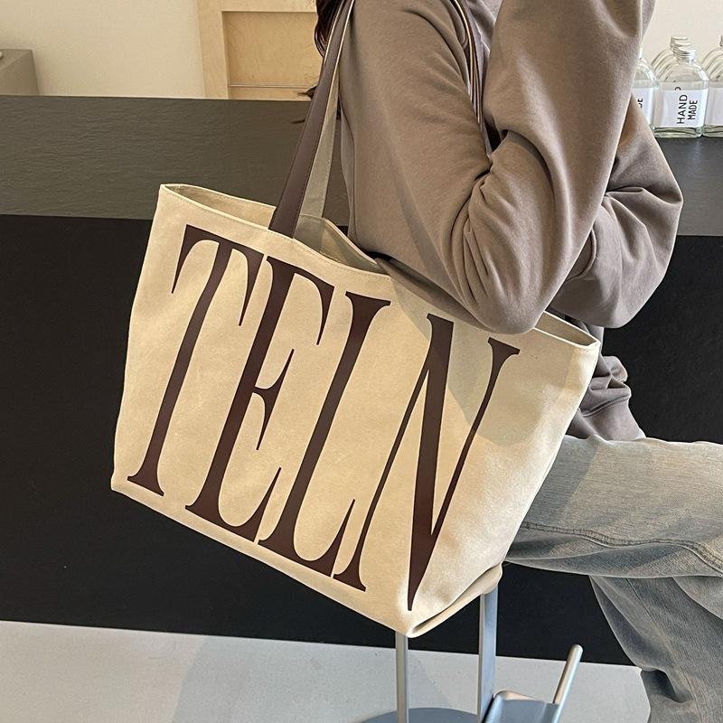 Fashion Korean version ins niche letter printed canvas bag 2025 new casual mommy shopping bag shoulder bag