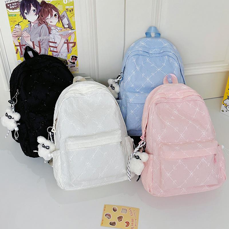 2025 new high-value travel lightweight junior high school student backpack women's large-capacity literary and versatile schoolbag