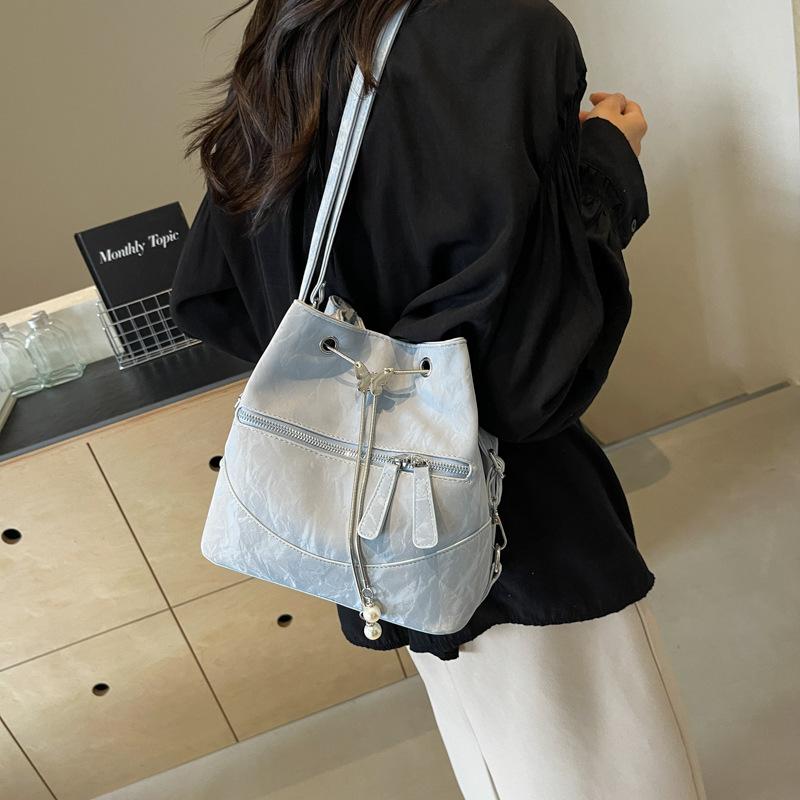 Silver bag women's 2025 new fashion backpack design sense school bag college student shoulder crossbody bucket bag