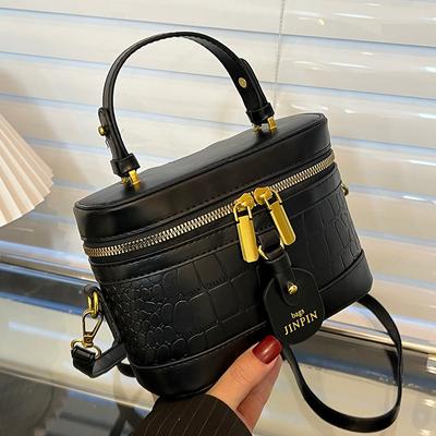 Borsa piccola a trama premium da donna primavera ed estate nuova moda nicchia borsa a tracolla da donna popolare borsa a secchiello portatile