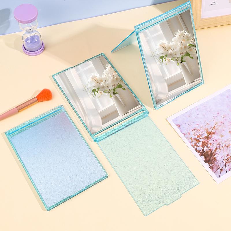 

Яркий хрустальный корпус. Складное зеркало для макияжа. Доступны 3 цвета. Дизайн с блестками. Дисплей высокой четкости. Женский макияж.