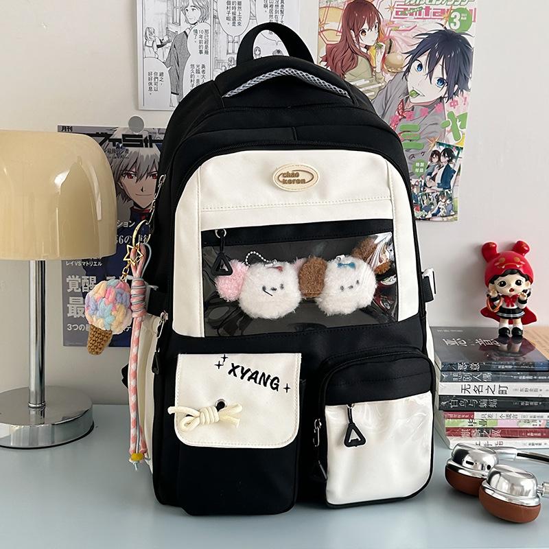 The new schoolbag is high-value, fresh and sweet, contrasting colors, splicing, and early high school students' lightweight travel backpack.