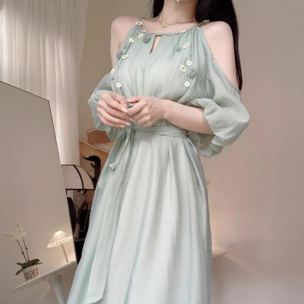 French cold feeling small daisy off-the-shoulder suspender dress women's summer new temperament socialite style loose medium and long dress