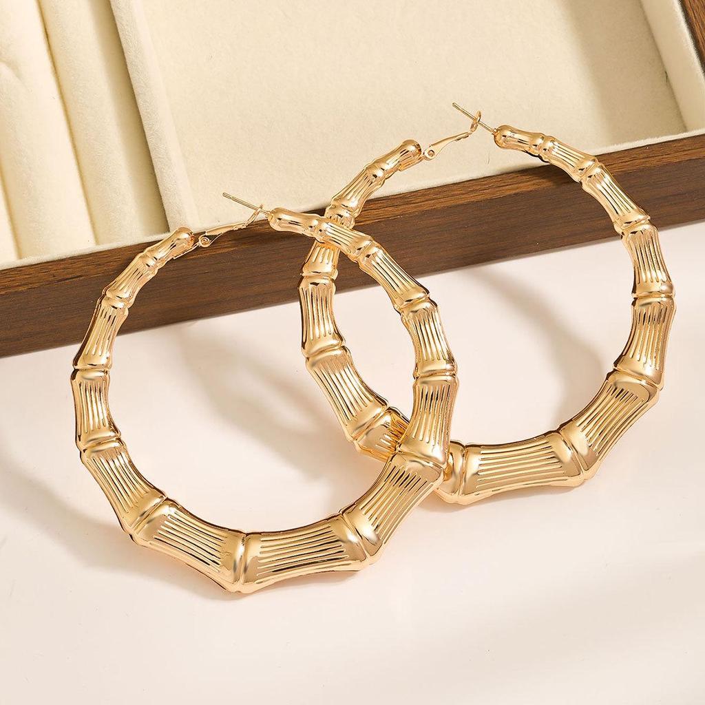 Extra-Large Gold Bamboo Hoops: Bold European & American Style Earrings for Hiphop, Street Dance, and Nightclub Fashion.