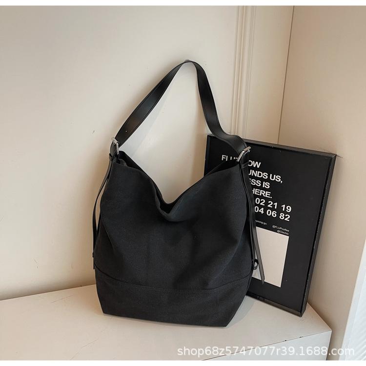 Casual large-capacity canvas bag women's 2025 new simple fashion tote bag Korean version commuter crossbody bag trend