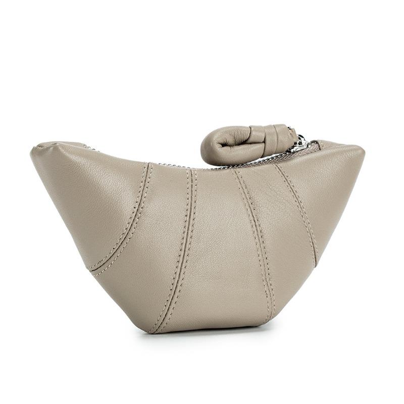 

New sheepskin niche high-end croissant leather hand change bag mini retro dumpling bag storage bag female