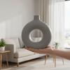 Decorative round vase with a hole, gray, for flowers, minimalist