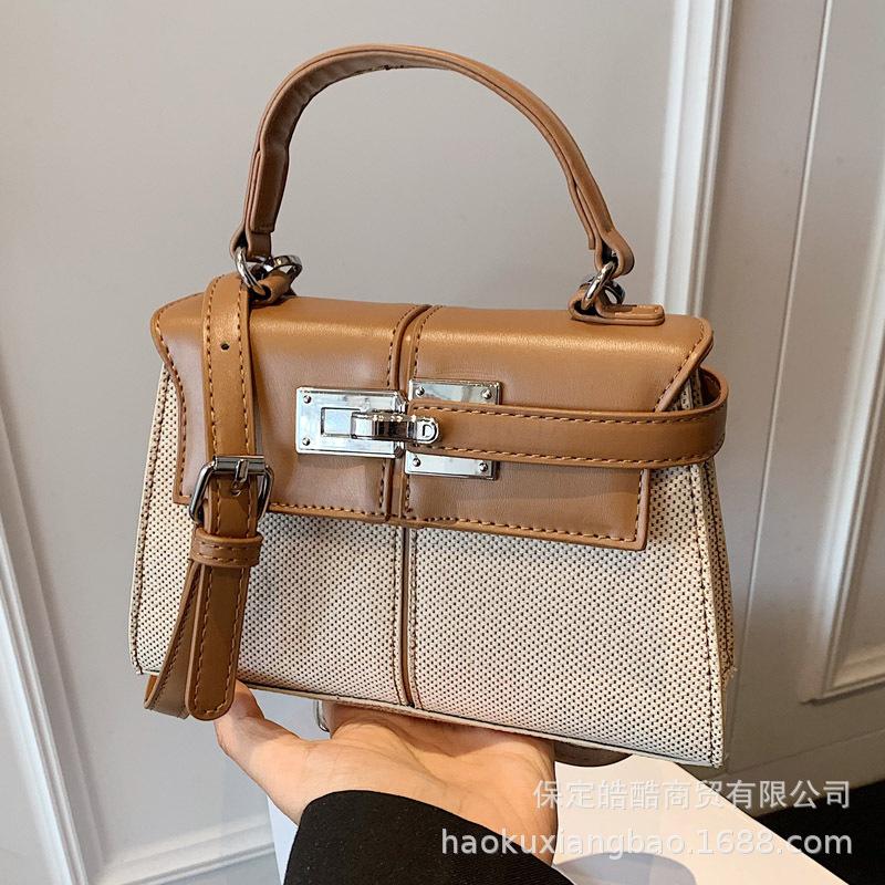 Korean version of high-quality, simple and versatile commuter handbag women's 2025 summer new niche messenger small square bag