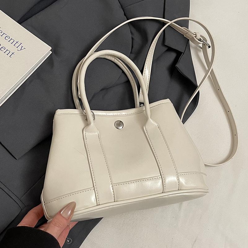 Korean New Product Sweet Cream Style Casual Portable Small Bag Temperament Versatile Simple Solid Color Commuter Messenger Women's Bag