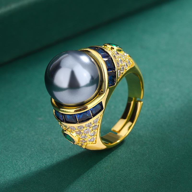 

Позолочена легка розкішна каблучка з вказівним пальцем із бісеру, каблучка з емальованими цирконовими перлинами, каблучка з таїтянськими сірими перлинами.