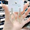 Fashion Geometric Bow Flower Pearl Earrings Women'S Premium Versatile Small Fragrant Wind Earrings