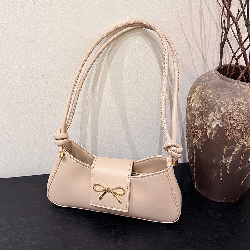 

Простая повседневная ретро однотонная 2025 весна новая нишевая мода зарубежный стиль дизайн на одно плечо подмышку сумка-багет женская хаки