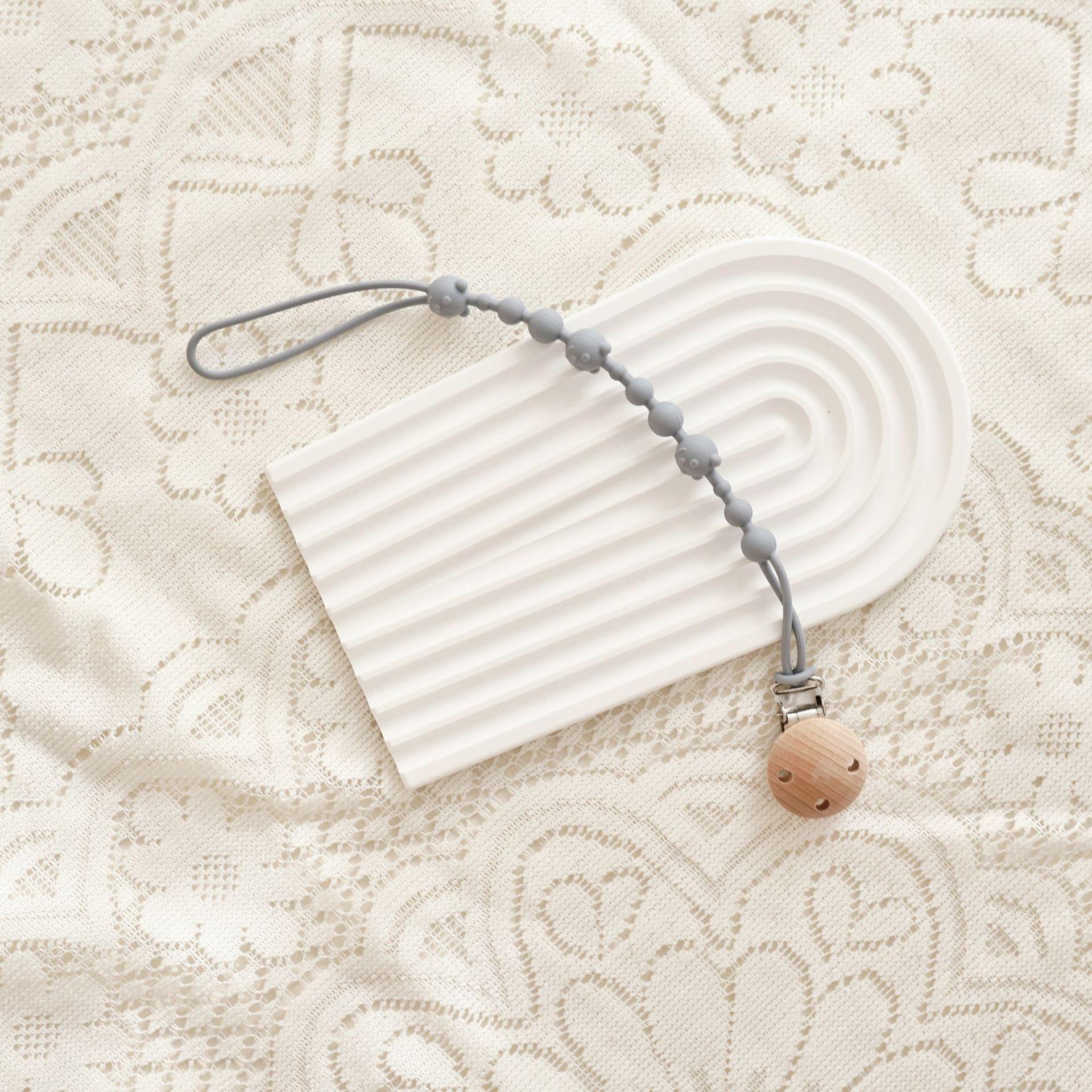 

Однотонная силиконовая цепочка-клипса для пустышки для младенцев, мальчиков и девочек, цепочка для десен для пустышки, прорезыватель, музыкальная игрушка-прорезыватель, веревочка против потери