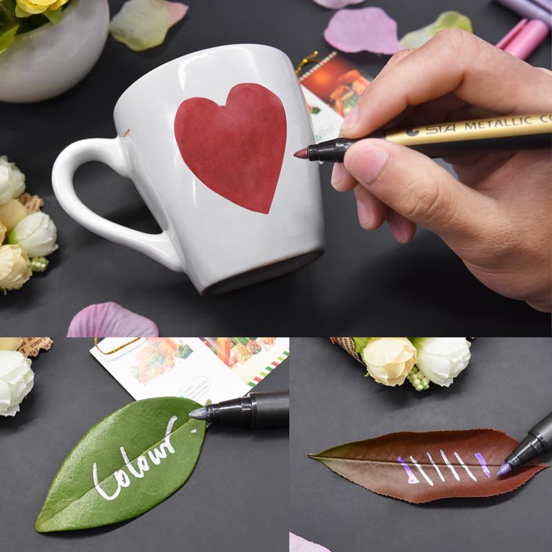 STA 8151 Colored Metal Paint Marker for DIY and Black Cardstock Art.