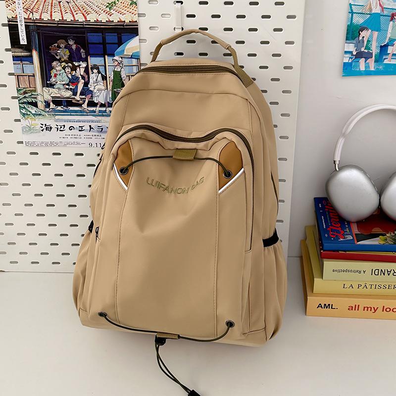 Simple and fashionable student backpack New casual outdoor sports backpack Middle school student large-capacity college style schoolbag