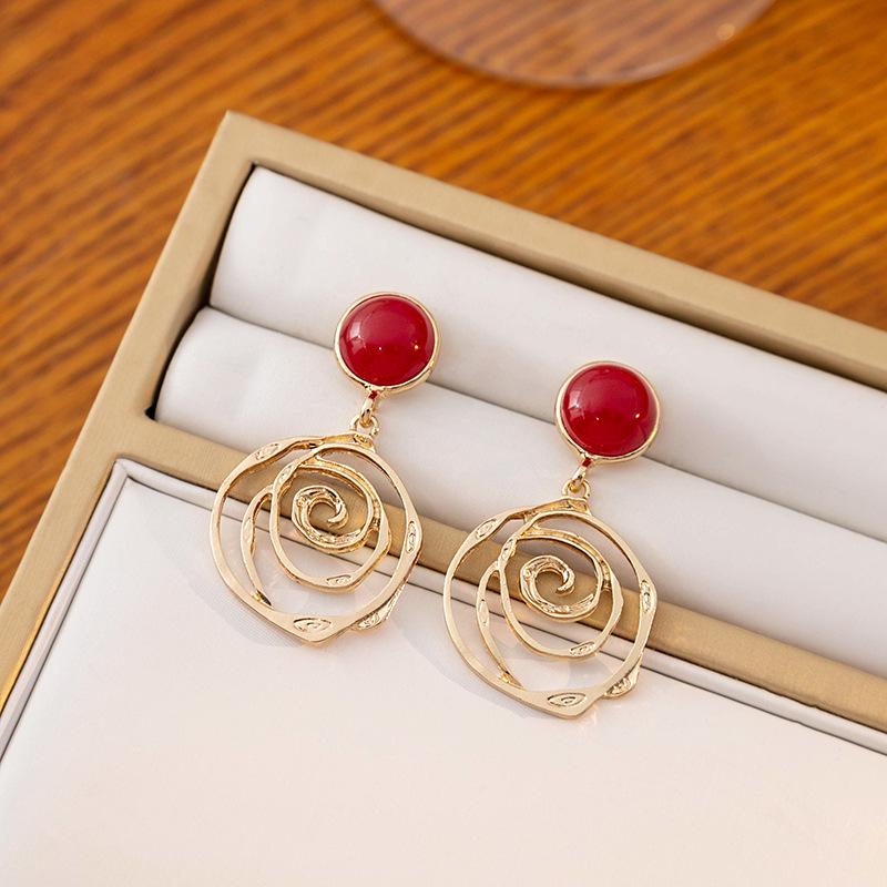 

Wine Red Irregular Hollow Round Earrings with Floral Design