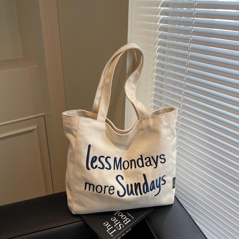

Korean version of casual canvas bag literary niche underarm bag women s 2025 new embroidered letter tote bag shopping bag bag